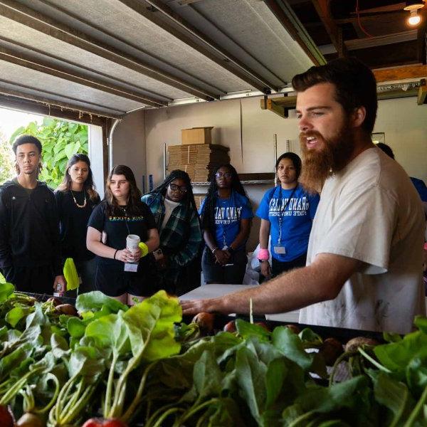 Students at College Prep Week get a tour of GVSU's Sustainable Farm Project.